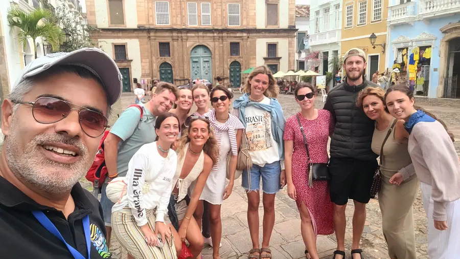 A group of travelers posing with us in Pelourinho