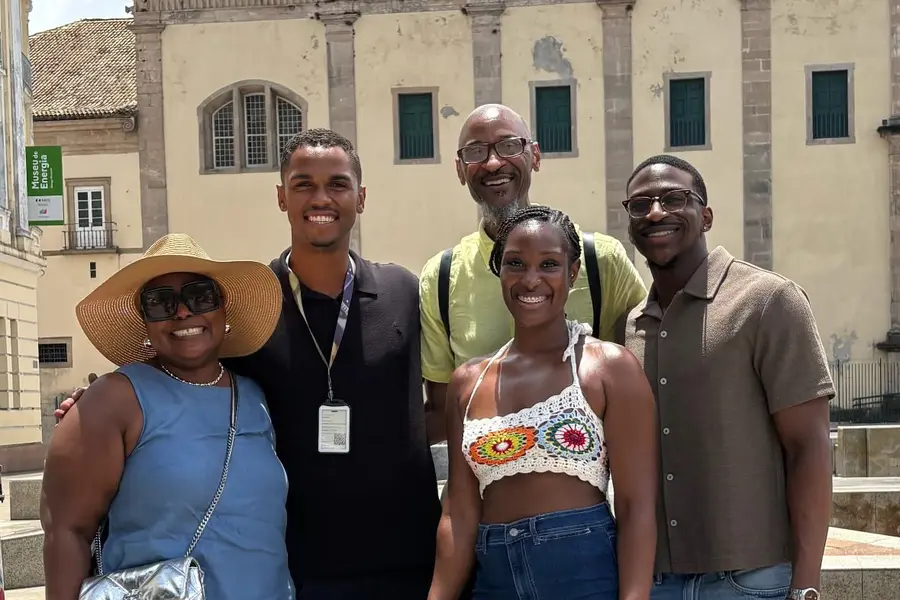 Adriano with a family of travelers in the historic center of Salvador